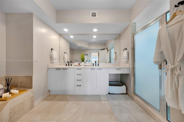 14951 Royal Oaks Ln Unit 901, North Miami, FL 33181 - bathroom with double vanity, a stall shower, recessed lighting, baseboards, and a tub to relax in