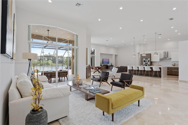 146 Dockside Cir, Weston, FL 33327 - living room with recessed lighting and light marble finish floors
