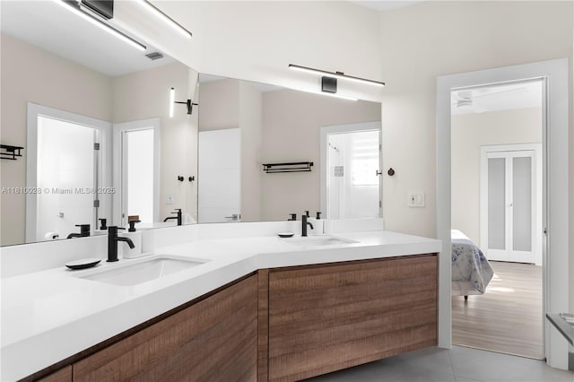 146 Dockside Cir, Weston, FL 33327 - full bathroom with double vanity, tile patterned floors, and ensuite bathroom