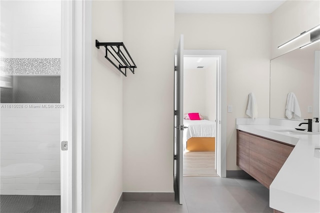 146 Dockside Cir, Weston, FL 33327 - full bathroom featuring vanity, tile patterned flooring, connected bathroom, a tile shower, and baseboards