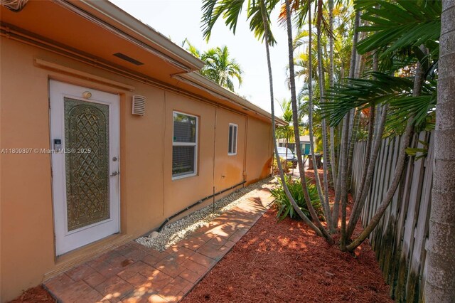 1215-1217 NE 16th Ave, Fort Lauderdale, FL 33304 - view of side of home with stucco siding