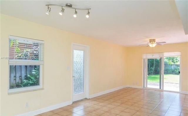 1215-1217 NE 16th Ave, Fort Lauderdale, FL 33304 - unfurnished room featuring a ceiling fan, light tile patterned flooring, and baseboards
