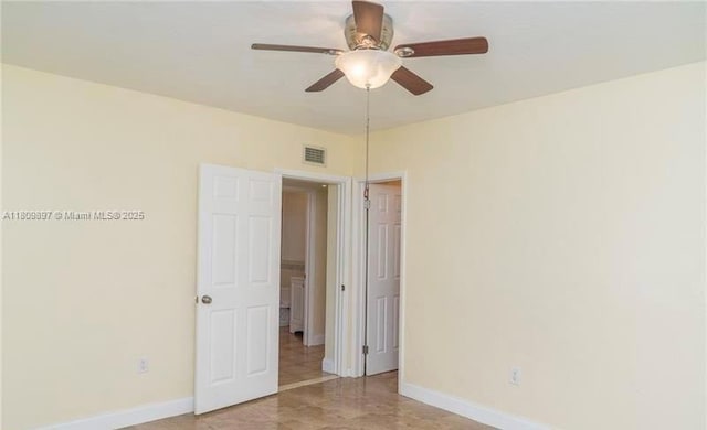 1215-1217 NE 16th Ave, Fort Lauderdale, FL 33304 - spare room with baseboards and ceiling fan