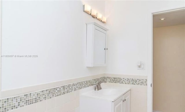 1215-1217 NE 16th Ave, Fort Lauderdale, FL 33304 - bathroom with vanity and tile walls