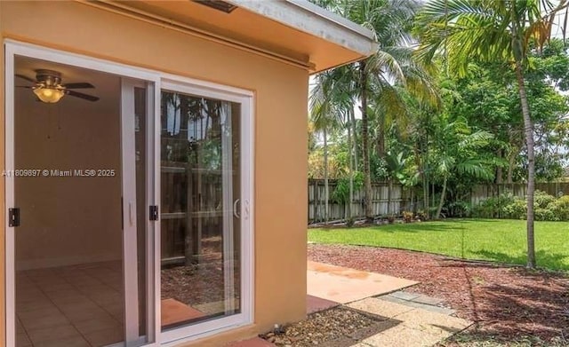 1215-1217 NE 16th Ave, Fort Lauderdale, FL 33304 - view of exterior entry with a patio and stucco siding