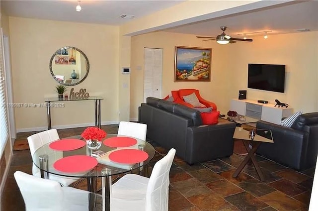1215-1217 NE 16th Ave, Fort Lauderdale, FL 33304 - dining space with a ceiling fan, dark stone finish flooring, and baseboards