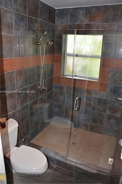 1215-1217 NE 16th Ave, Fort Lauderdale, FL 33304 - bathroom with a stall shower and toilet