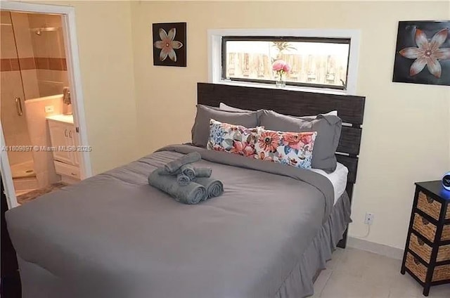 1215-1217 NE 16th Ave, Fort Lauderdale, FL 33304 - bedroom featuring ensuite bathroom, baseboards, and light tile patterned flooring