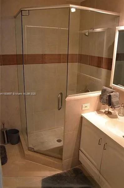 1215-1217 NE 16th Ave, Fort Lauderdale, FL 33304 - full bathroom featuring vanity and a stall shower