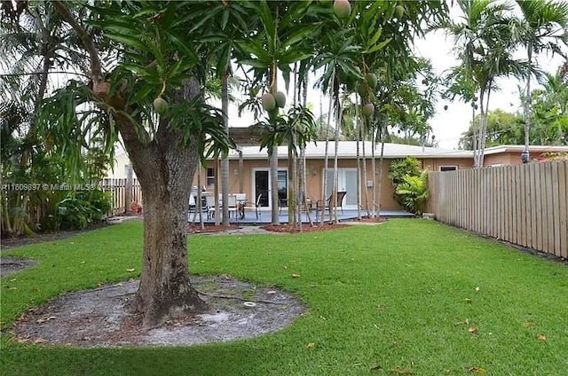 1215-1217 NE 16th Ave, Fort Lauderdale, FL 33304 - view of yard with a patio