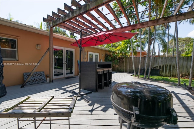 1215-1217 NE 16th Ave, Fort Lauderdale, FL 33304 - wooden terrace with french doors and a pergola