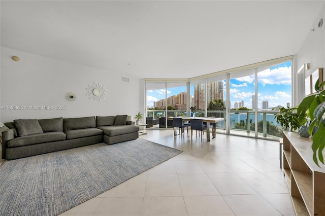 3131 NE 188th St Unit 2-506, Aventura, FL 33180 - living room with expansive windows, a skyline view, plenty of natural light, and light tile patterned floors