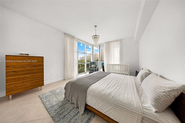 3131 NE 188th St Unit 2-506, Aventura, FL 33180 - bedroom featuring light tile patterned floors and baseboards