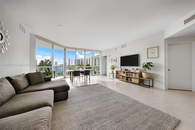 3131 NE 188th St Unit 2-506, Aventura, FL 33180 - living area featuring a wall of windows and light tile patterned flooring