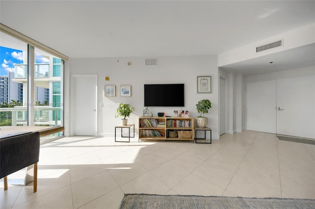 3131 NE 188th St Unit 2-506, Aventura, FL 33180 - living area featuring tile patterned floors and a wall of windows