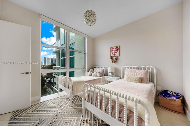 3131 NE 188th St Unit 2-506, Aventura, FL 33180 - tiled bedroom with floor to ceiling windows, baseboards, and a city view