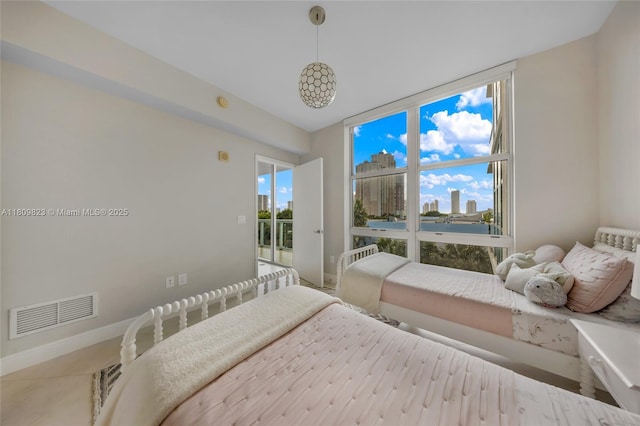 3131 NE 188th St Unit 2-506, Aventura, FL 33180 - bedroom featuring floor to ceiling windows, baseboards, and a view of city
