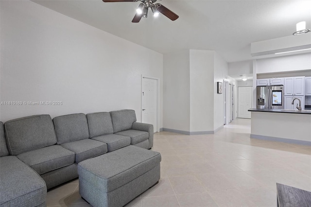 3340 Palomino Dr Unit 214-2, Davie, FL 33024 - living area with a ceiling fan, light tile patterned floors, and baseboards