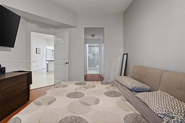 3340 Palomino Dr Unit 214-2, Davie, FL 33024 - bedroom featuring wood finished floors and ensuite bathroom