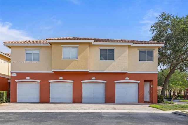 3340 Palomino Dr Unit 214-2, Davie, FL 33024 - multi unit property with a tile roof, stucco siding, and an attached garage