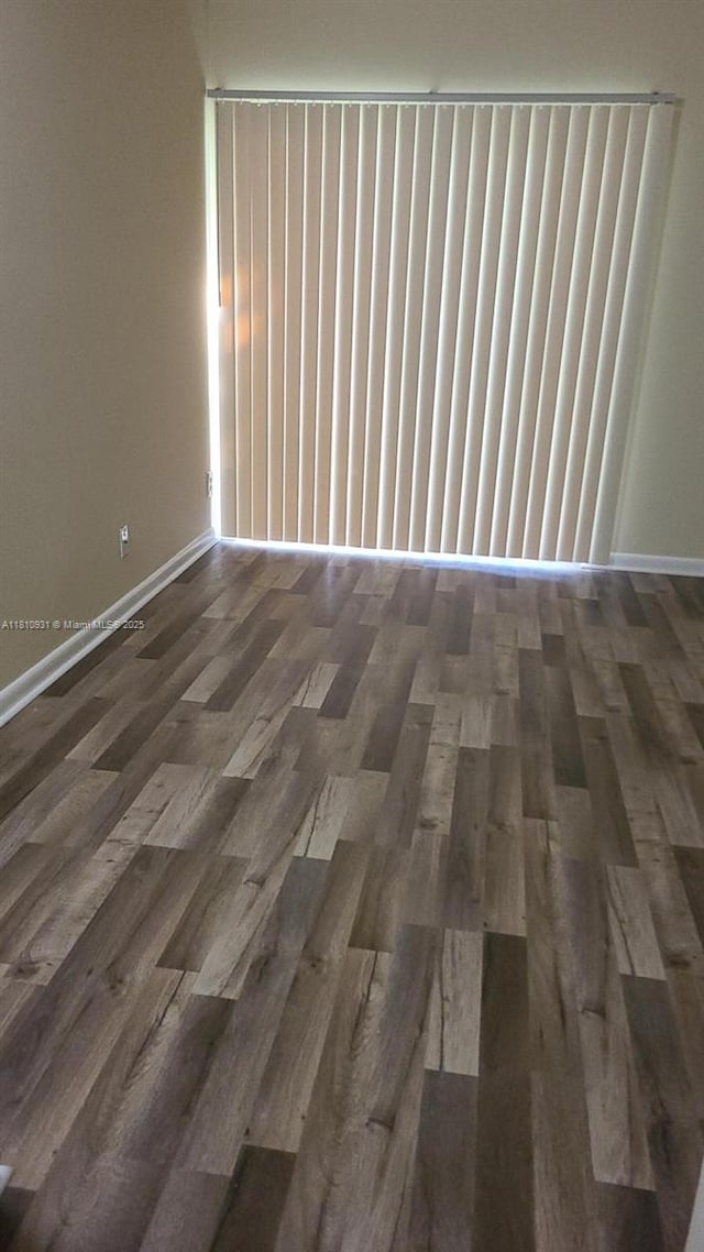 8540 N Sherman Cir Unit 204, Miramar, FL 33025 - spare room with wood finished floors and baseboards