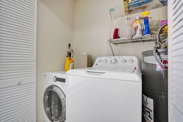 14671 Bonaire Blvd Unit 510, Delray Beach, FL 33446 - laundry area with water heater and independent washer and dryer