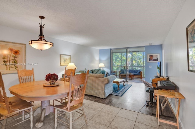 14671 Bonaire Blvd Unit 510, Delray Beach, FL 33446 - dining room with a textured ceiling and light tile patterned floors