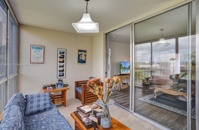 14671 Bonaire Blvd Unit 510, Delray Beach, FL 33446 - tiled living area with a textured wall and expansive windows