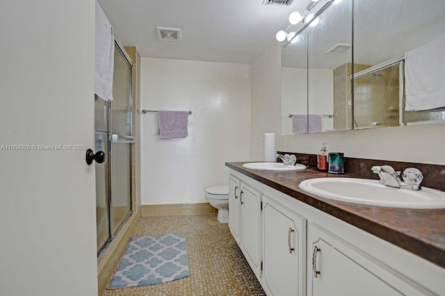 14671 Bonaire Blvd Unit 510, Delray Beach, FL 33446 - bathroom featuring an enclosed shower, double vanity, and toilet
