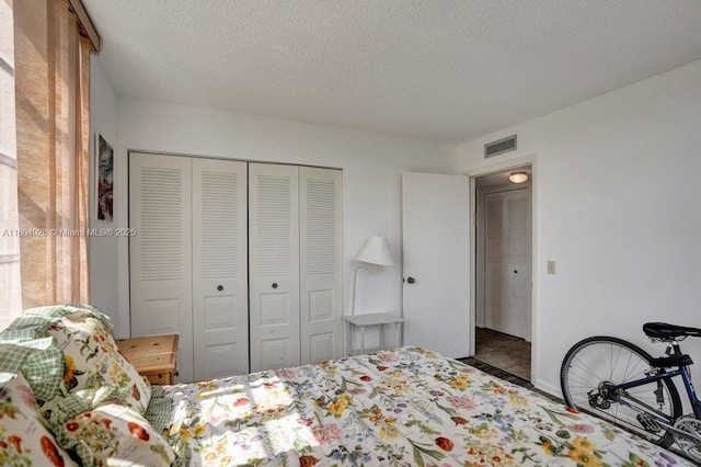 14671 Bonaire Blvd Unit 510, Delray Beach, FL 33446 - bedroom featuring a closet and a textured ceiling