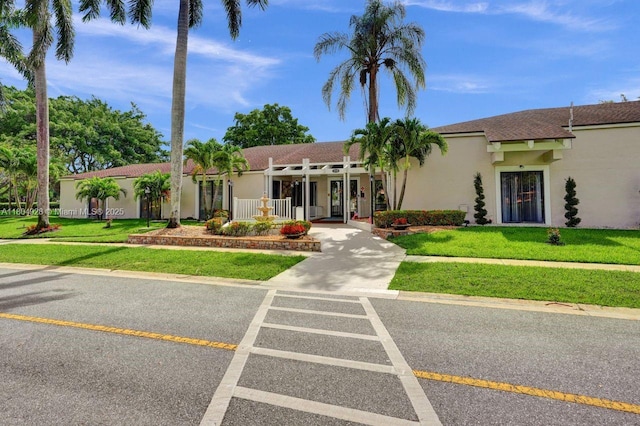 14671 Bonaire Blvd Unit 510, Delray Beach, FL 33446 - view of front of property featuring stucco siding and a front lawn