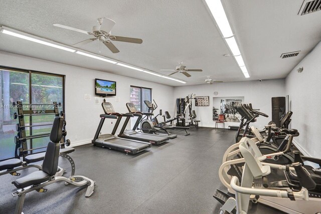 14671 Bonaire Blvd Unit 510, Delray Beach, FL 33446 - gym with a ceiling fan, baseboards, and a textured ceiling