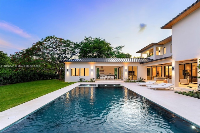11001 SW 65th Ave, Pinecrest, FL 33156 - outdoor pool with a patio area, a lawn, and an outdoor hangout area