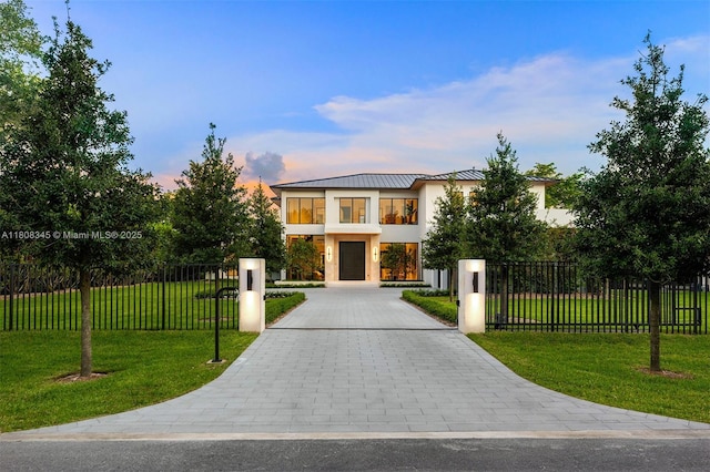 11001 SW 65th Ave, Pinecrest, FL 33156 - contemporary house with driveway and stucco siding