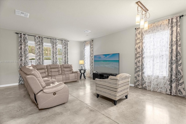 5781 SW 39th St, Ocala, FL 34474 - living area featuring finished concrete flooring and baseboards