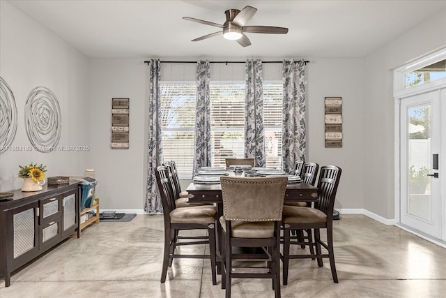 5781 SW 39th St, Ocala, FL 34474 - dining room featuring finished concrete floors, ceiling fan, and baseboards