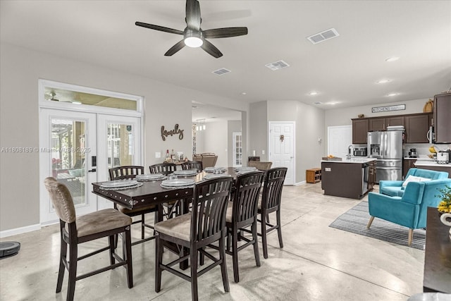 5781 SW 39th St, Ocala, FL 34474 - dining space with concrete flooring, french doors, baseboards, and a ceiling fan