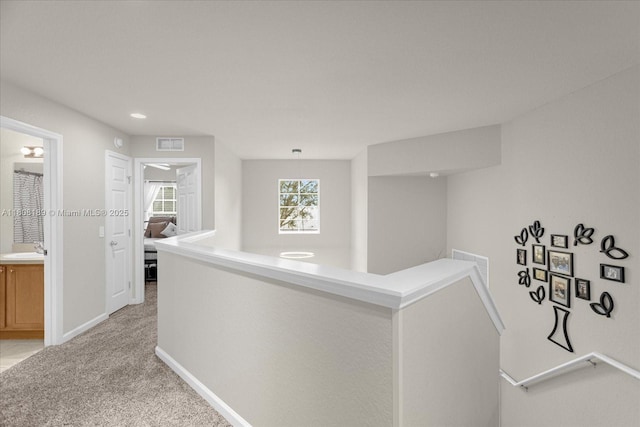 5781 SW 39th St, Ocala, FL 34474 - hall featuring an upstairs landing, a sink, light carpet, baseboards, and recessed lighting