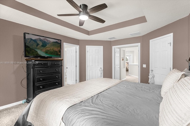 5781 SW 39th St, Ocala, FL 34474 - carpeted bedroom featuring baseboards, a tray ceiling, and ceiling fan
