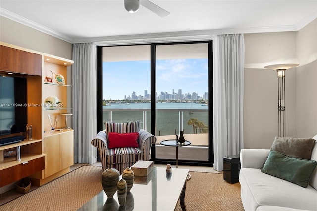 9 Island Ave Unit 505, Miami Beach, FL 33139 - living area with a view of skyline, ceiling fan, crown molding, and floor to ceiling windows