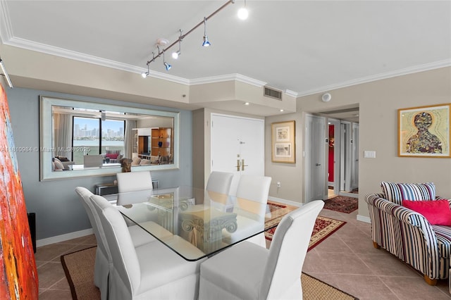 9 Island Ave Unit 505, Miami Beach, FL 33139 - tiled dining room featuring crown molding and track lighting