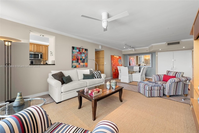 9 Island Ave Unit 505, Miami Beach, FL 33139 - living room with ornamental molding, ceiling fan, and track lighting