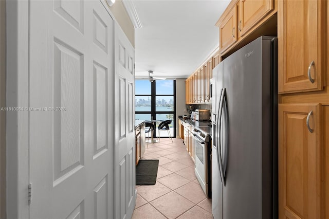 9 Island Ave Unit 505, Miami Beach, FL 33139 - kitchen with stainless steel appliances, light tile patterned floors, a water view, and expansive windows