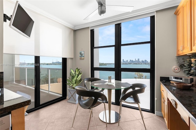 9 Island Ave Unit 505, Miami Beach, FL 33139 - dining room with crown molding, ceiling fan, a water view, healthy amount of natural light, and light tile patterned floors