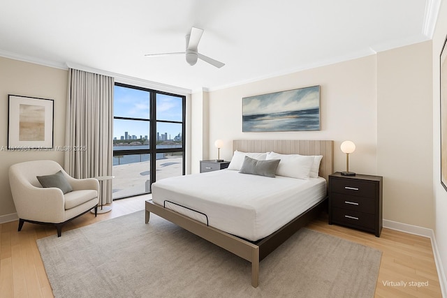 9 Island Ave Unit 505, Miami Beach, FL 33139 - bedroom featuring crown molding, light wood-type flooring, ceiling fan, floor to ceiling windows, and access to outside