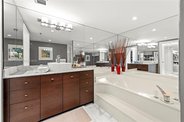 9 Island Ave Unit 505, Miami Beach, FL 33139 - full bathroom with a bath, vanity, marble look tiles, and recessed lighting