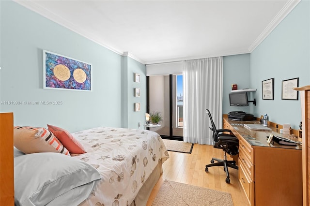 9 Island Ave Unit 505, Miami Beach, FL 33139 - bedroom featuring crown molding, light wood-style floors, a desk, and access to exterior