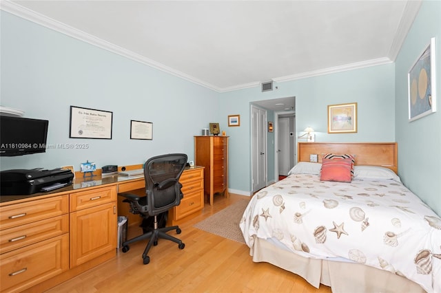 9 Island Ave Unit 505, Miami Beach, FL 33139 - bedroom featuring ornamental molding, light wood-style flooring, and a desk