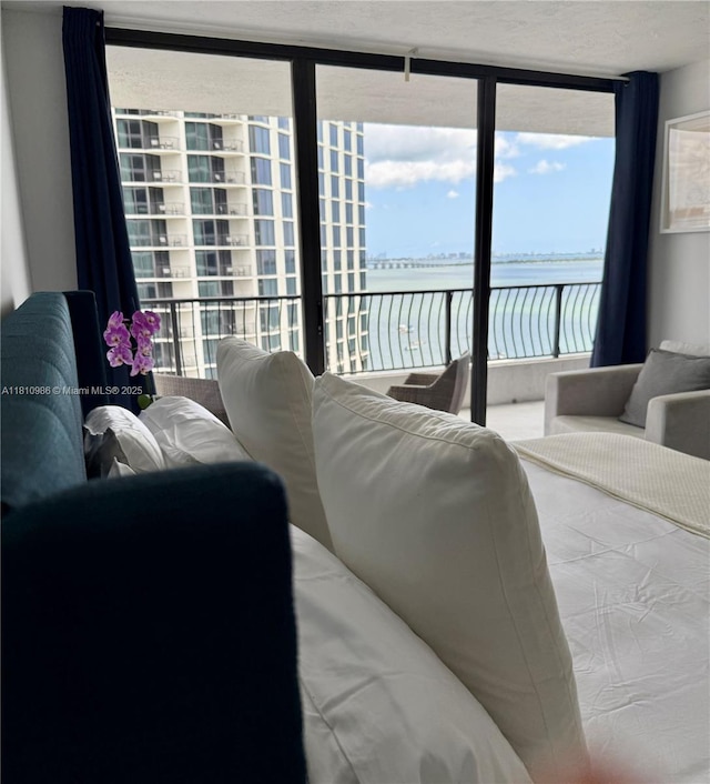 555 NE 15th St Unit 15G, Miami, FL 33132 - bedroom featuring access to exterior and a water view