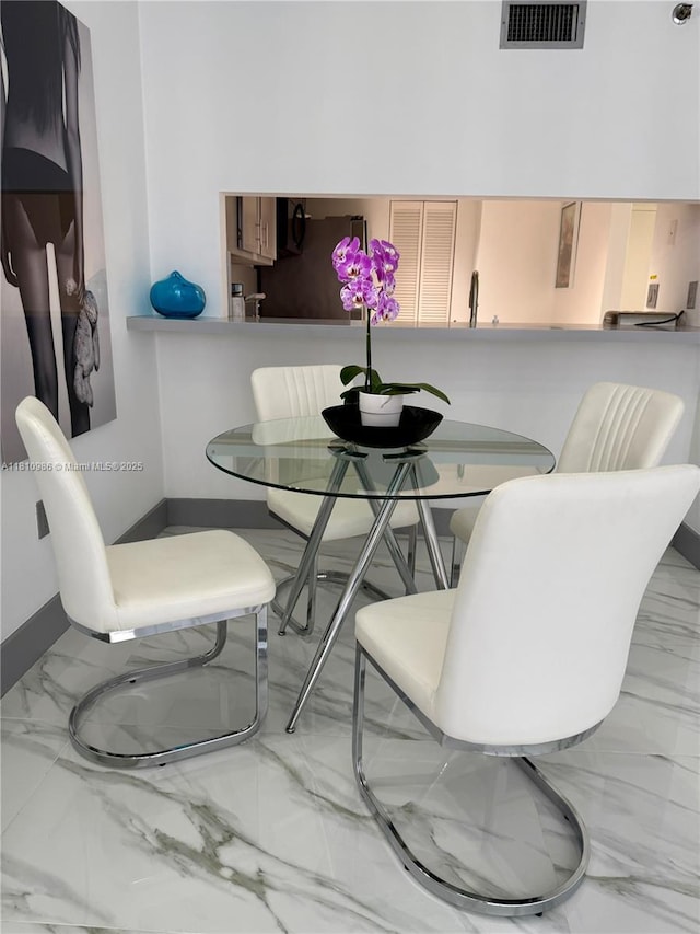 555 NE 15th St Unit 15G, Miami, FL 33132 - dining area with marble finish floors and baseboards